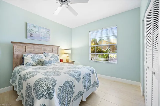 a bedroom with a bed and a night stand