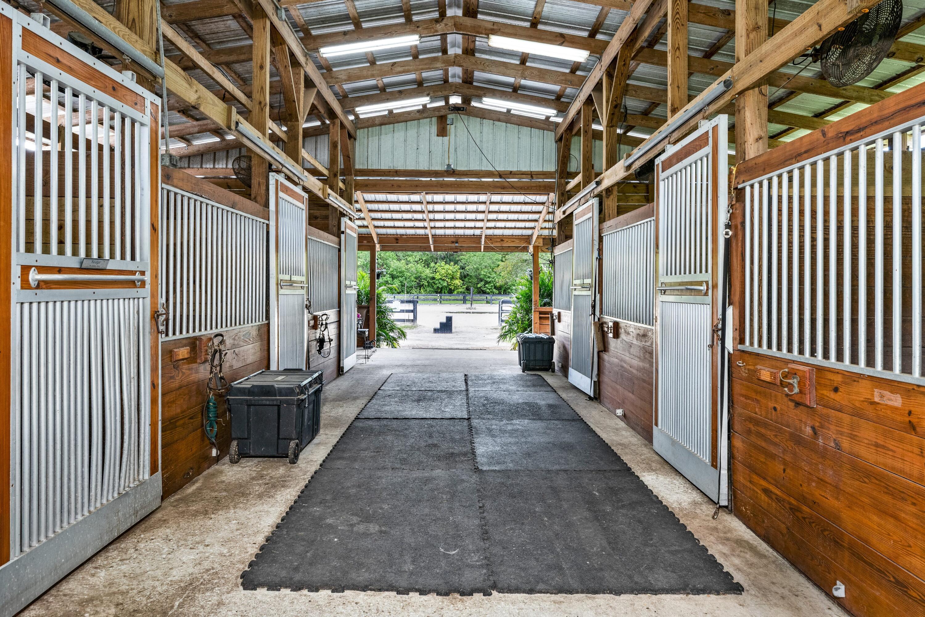 14536 N Road Loxahatchee Groves, FL 33470 - Photo 12 of 79 Center Aisle 7 Stall Barn