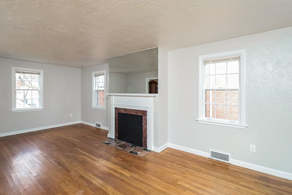18 Alice Street Pittsburgh, PA 30342 - Photo 2 of 11 a view of an empty room with wooden floor and a window