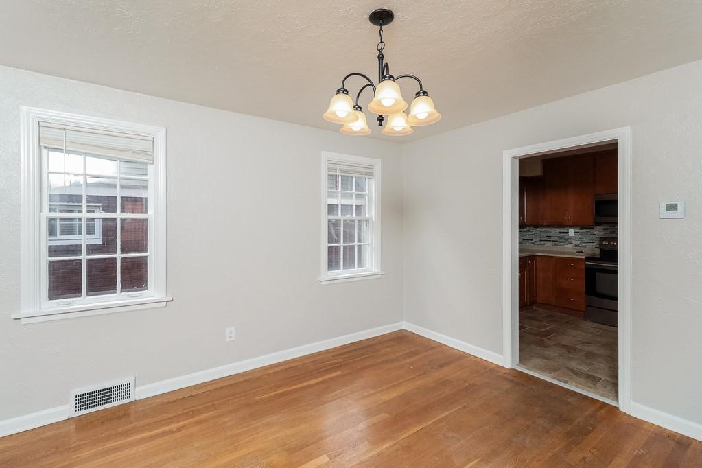 18 Alice Street Pittsburgh, PA 30342 - Photo 3 of 11 a view of an empty room with window and wooden floor