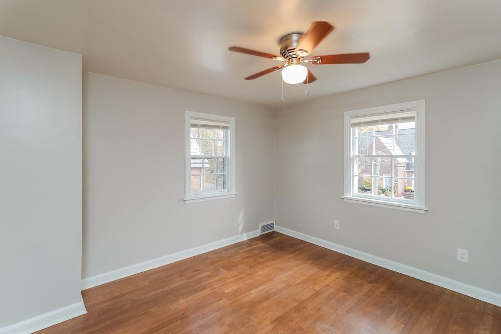 18 Alice Street Pittsburgh, PA 30342 - Photo 6 of 11 a view of an empty room with wooden floor and a window