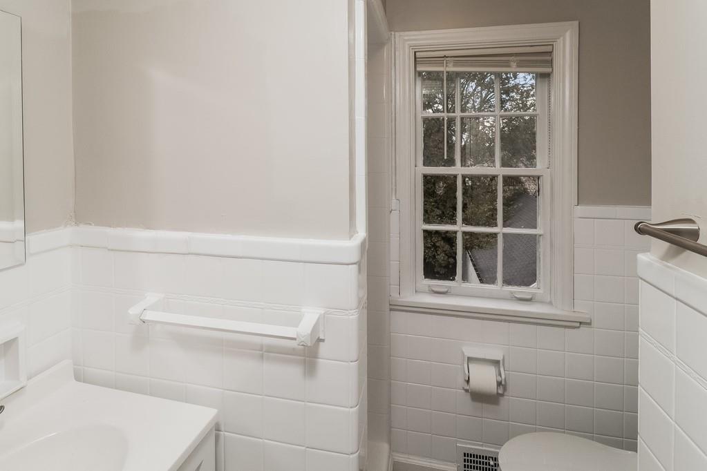 18 Alice Street Pittsburgh, PA 30342 - Photo 7 of 11 a bathroom with a toilet and a window