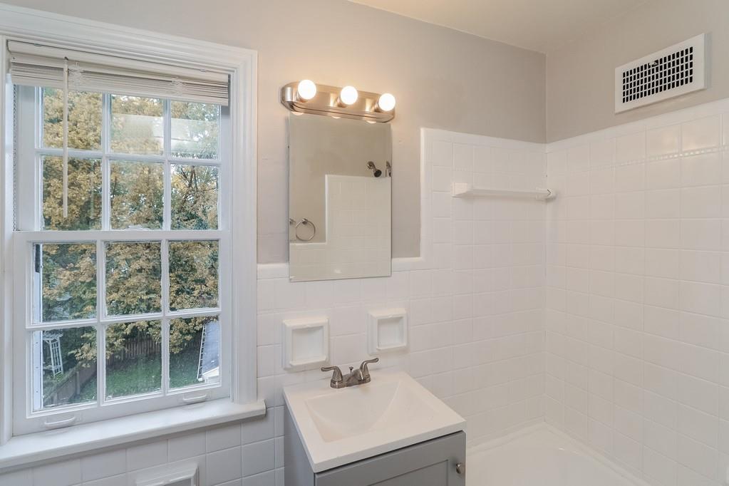 18 Alice Street Pittsburgh, PA 30342 - Photo 9 of 11 a bathroom with a sink a vanity and a mirror
