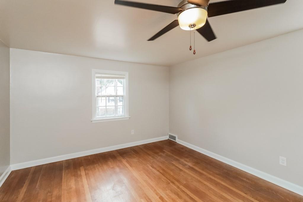 18 Alice Street Pittsburgh, PA 30342 - Photo 10 of 11 an empty room with a window and a chandelier fan