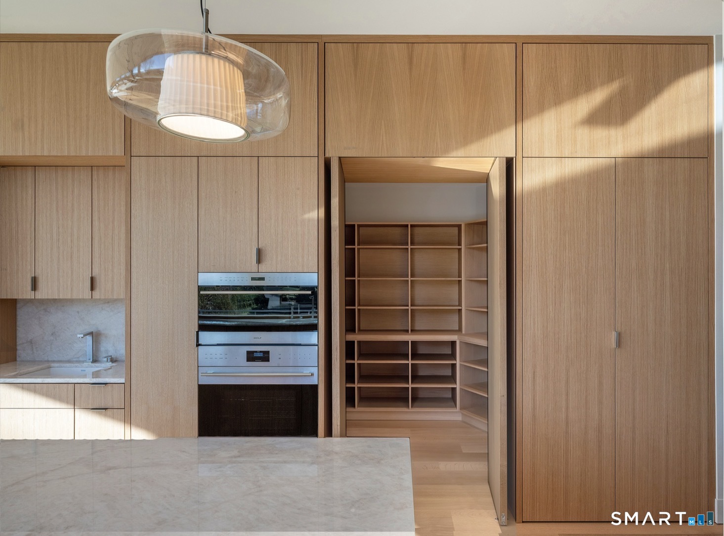 314 Ferry Road Old Lyme, CT 06371 - Photo 13 of 40 A large walk-in pantry offers plenty of additional storage for food and cookware. A second sink with surrounding cabinetry provides a convenient bar area for entertaining.