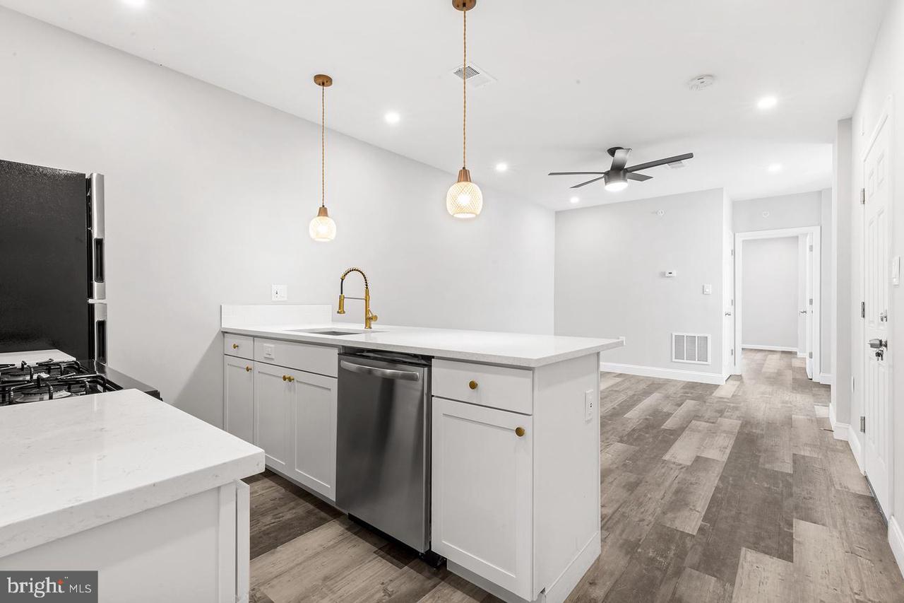 a kitchen with a sink and a refrigerator