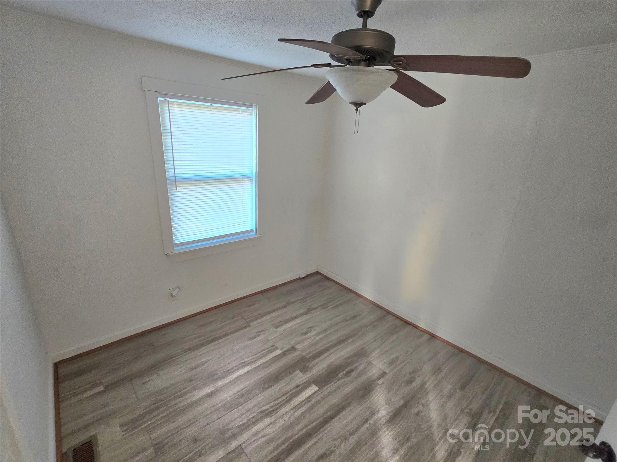 1900 Double Oaks Road Charlotte, NC 28206 - Photo 12 of 22 an empty room with a window