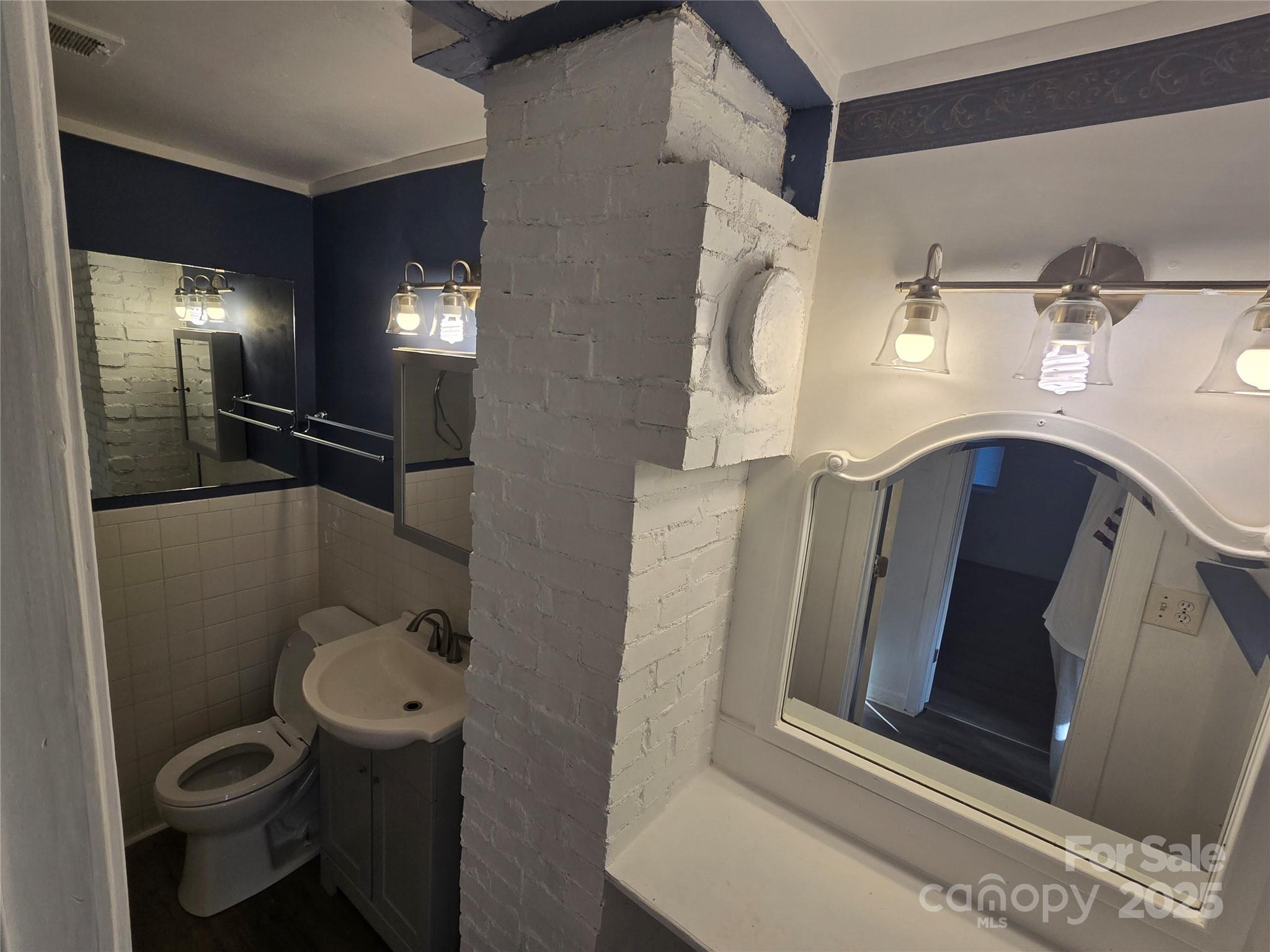 1900 Double Oaks Road Charlotte, NC 28206 - Photo 17 of 22 a bathroom with a toilet and a sink