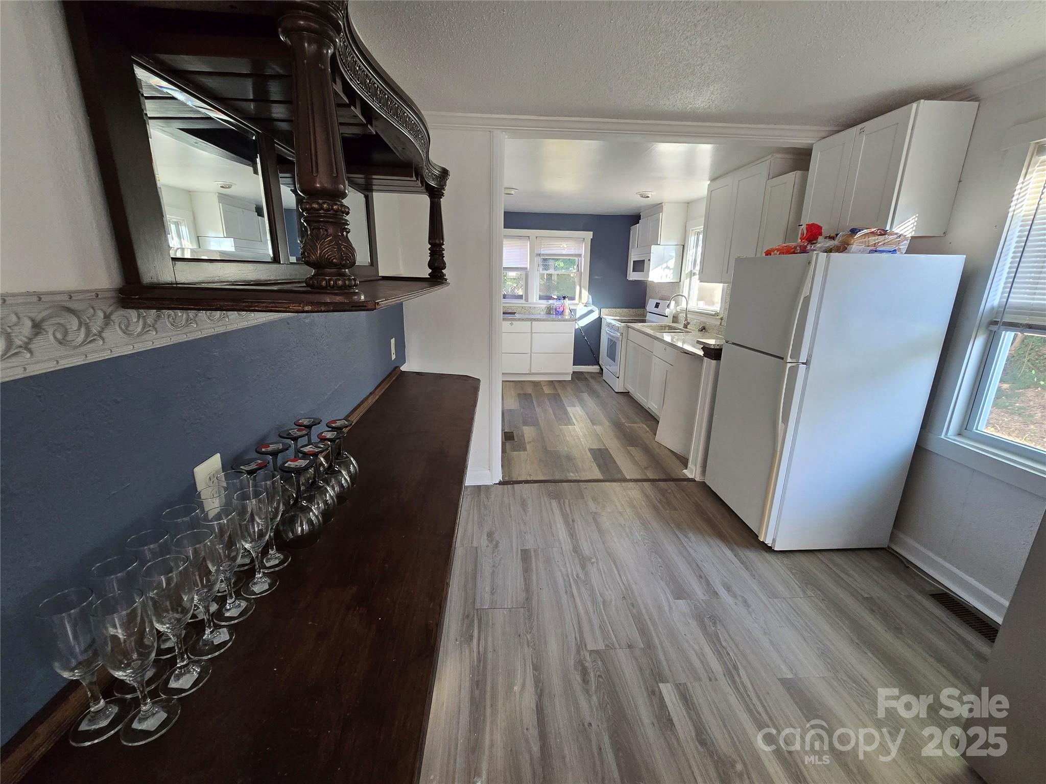 1900 Double Oaks Road Charlotte, NC 28206 - Photo 6 of 22 a view of a hallway with wooden floor and staircase