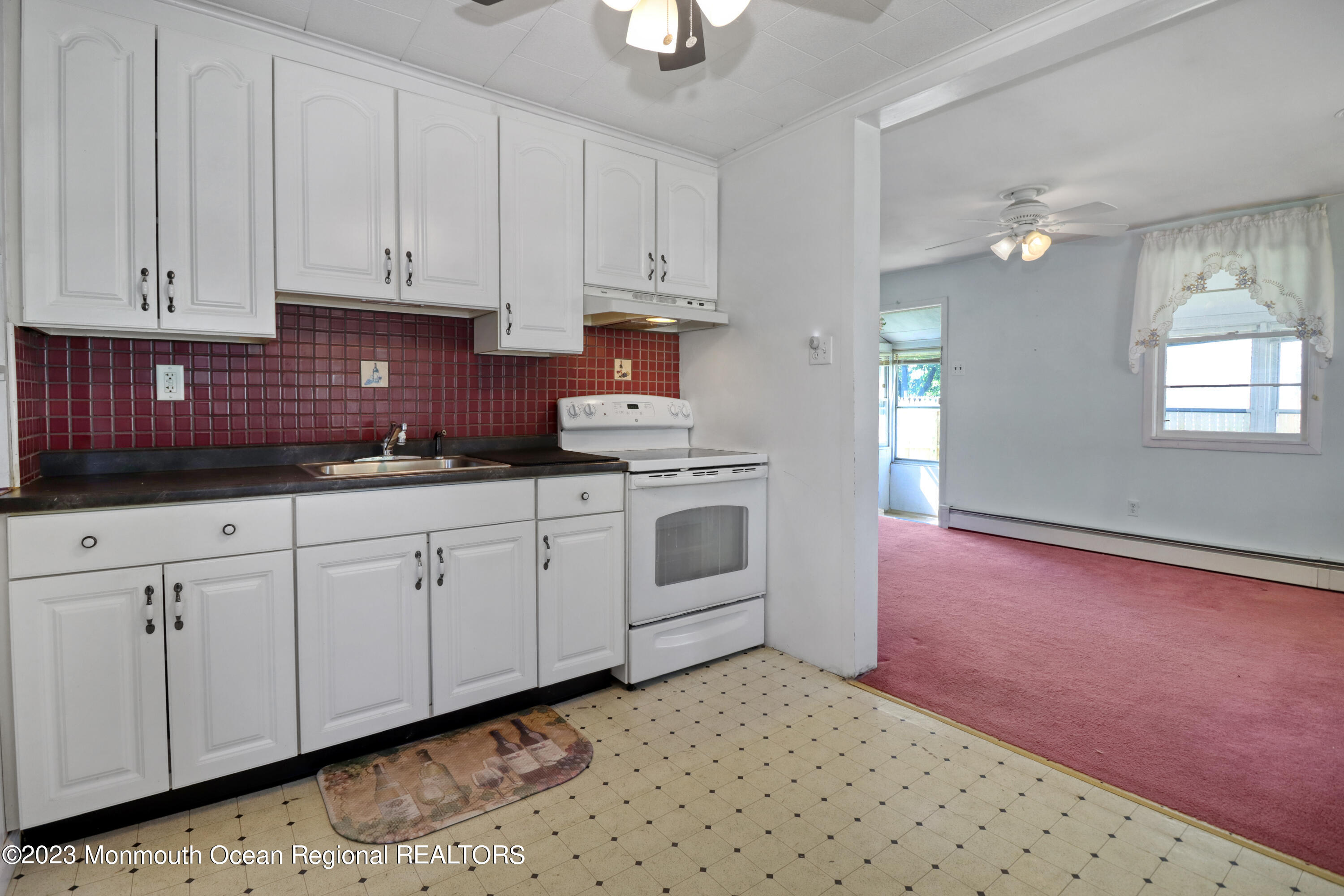 66 Jacobstown Road New Egypt, NJ 08533 - Photo 20 of 39 a kitchen with granite countertop white cabinets and white appliances