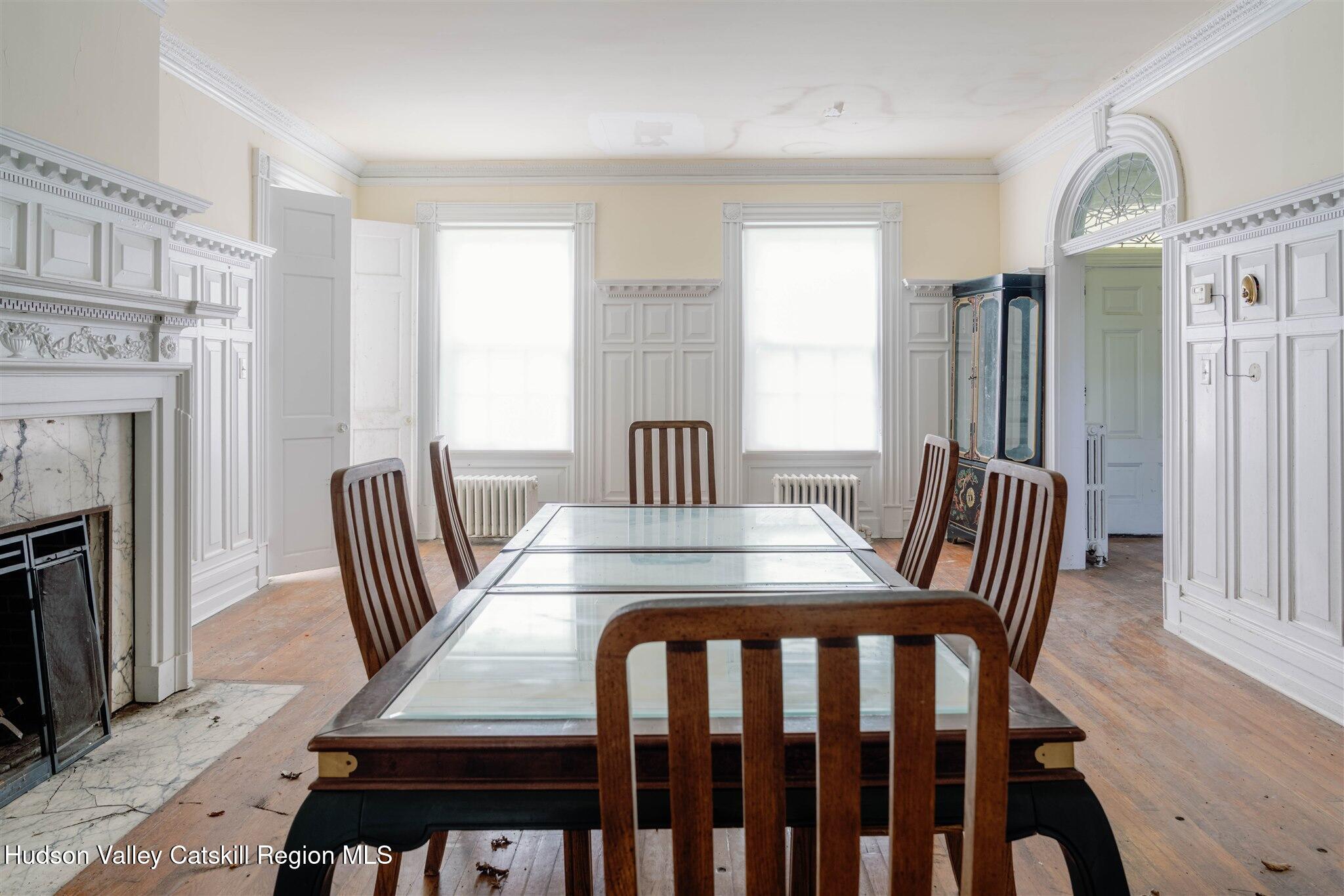 37-60 Blackburn Road Selkirk, NY 12158 - Photo 11 of 39 a view of a dining room with furniture window and wooden floor
