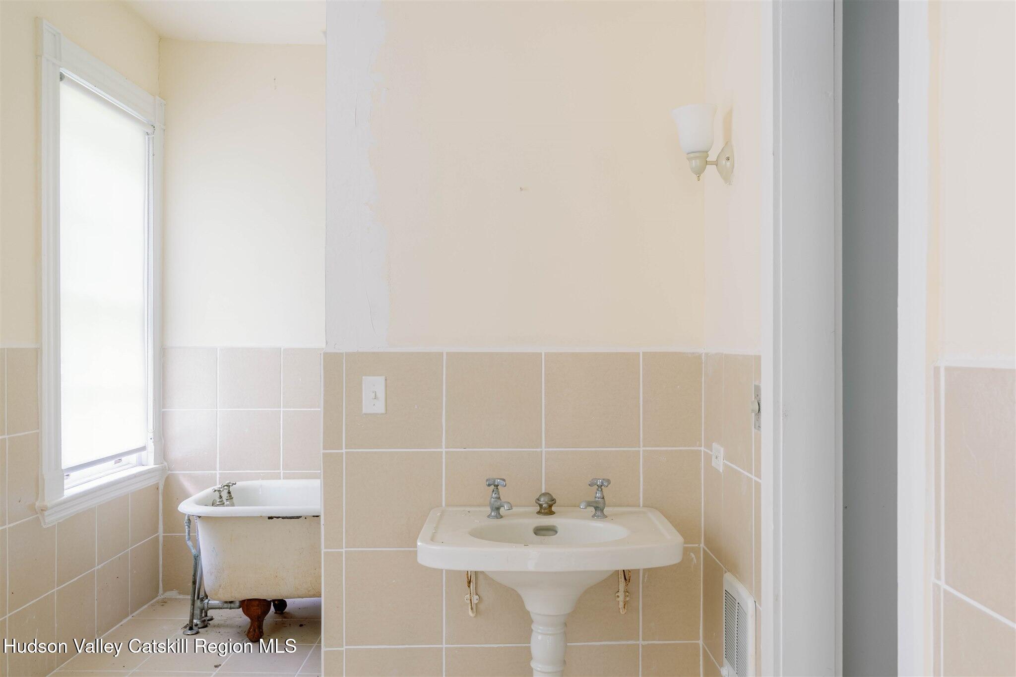 37-60 Blackburn Road Selkirk, NY 12158 - Photo 16 of 39 a bathroom with a sink and a mirror