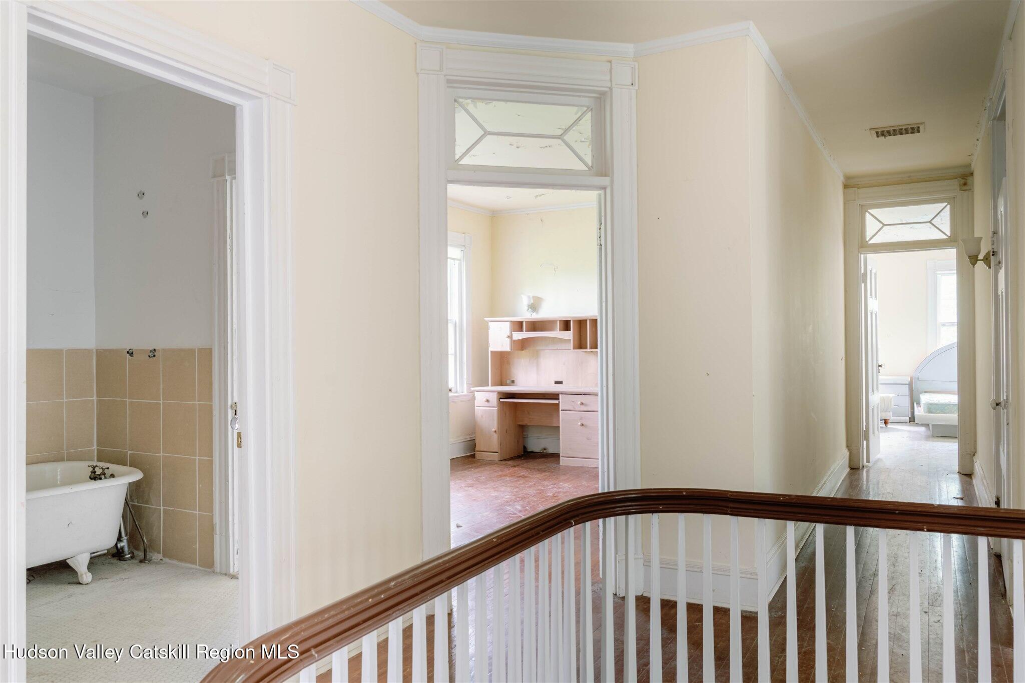 37-60 Blackburn Road Selkirk, NY 12158 - Photo 17 of 39 a view of a hallway view with wooden floor and a bathroom