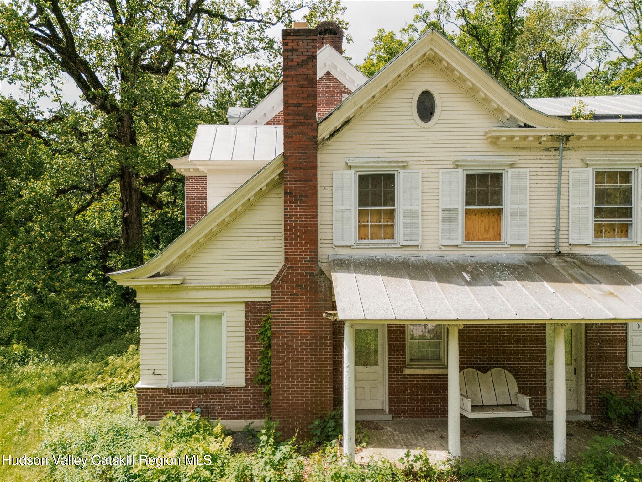 37-60 Blackburn Road Selkirk, NY 12158 - Photo 20 of 39 a view of a white house with a yard and potted plants