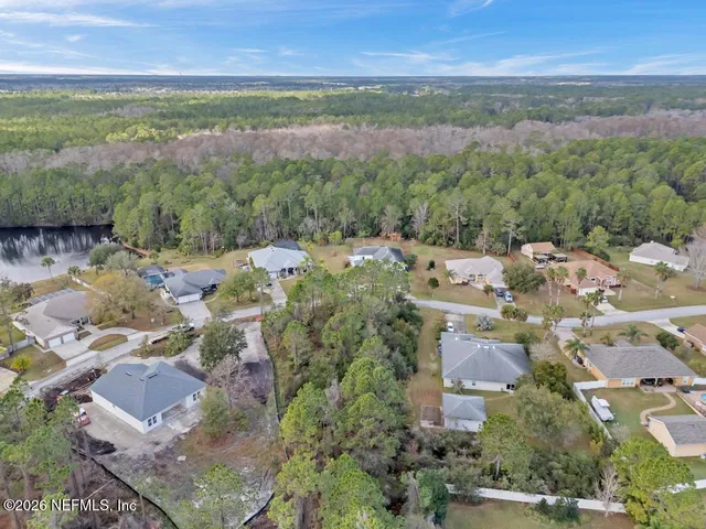 an aerial view of residential house with outdoor space