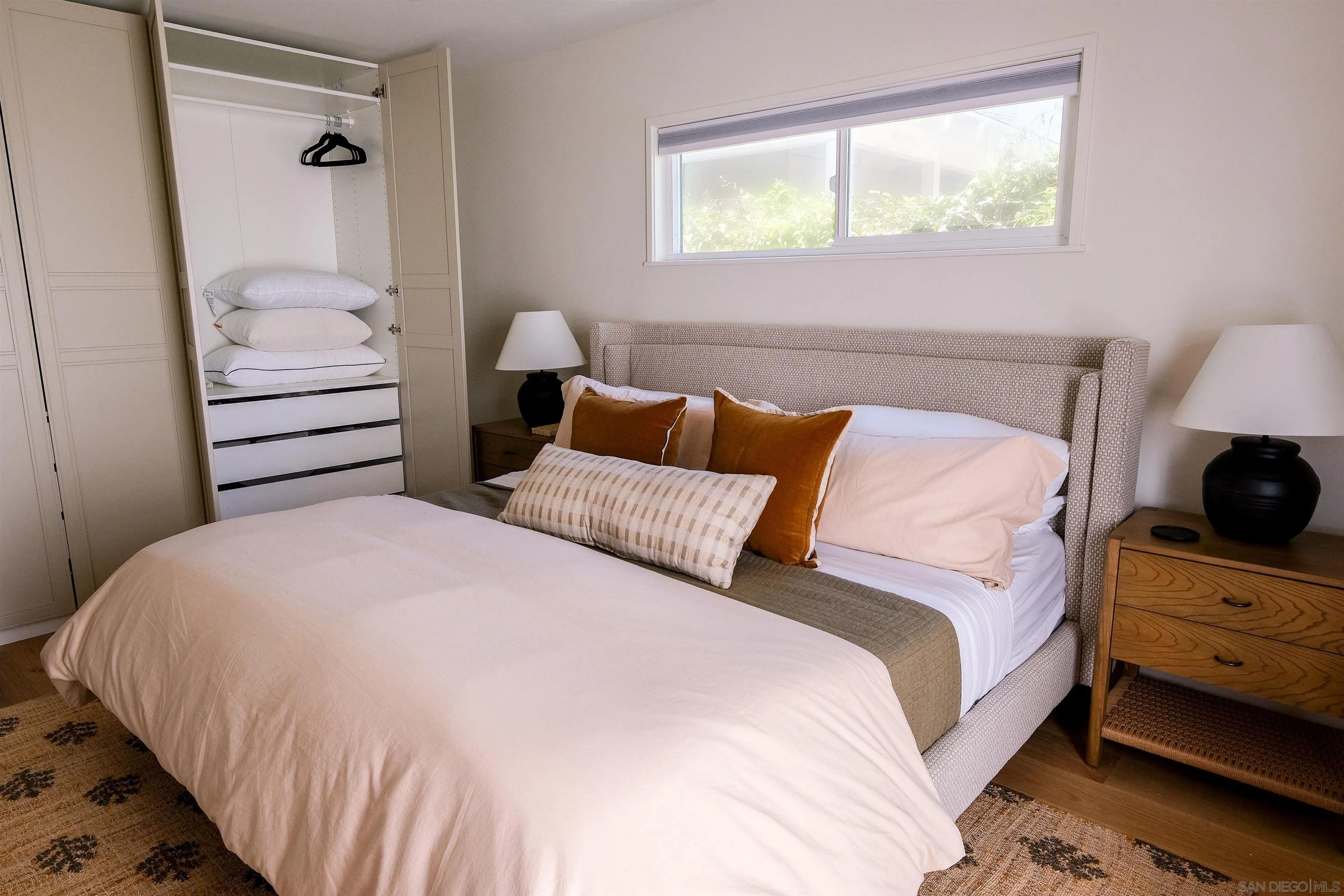 1915 Montgomery Avenue Cardiff-by-the-Sea, CA 92007 - Photo 12 of 32 a bedroom with a bed and a window