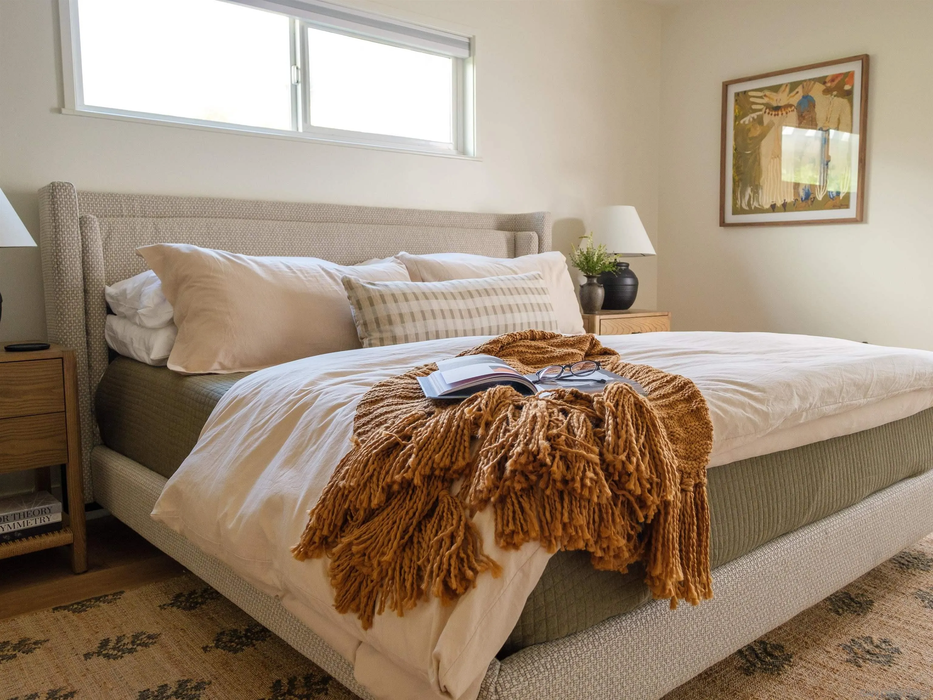 1915 Montgomery Avenue Cardiff-by-the-Sea, CA 92007 - Photo 13 of 32 a bed sitting in a bedroom next to a window