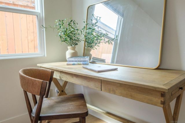 a dining room with furniture and window