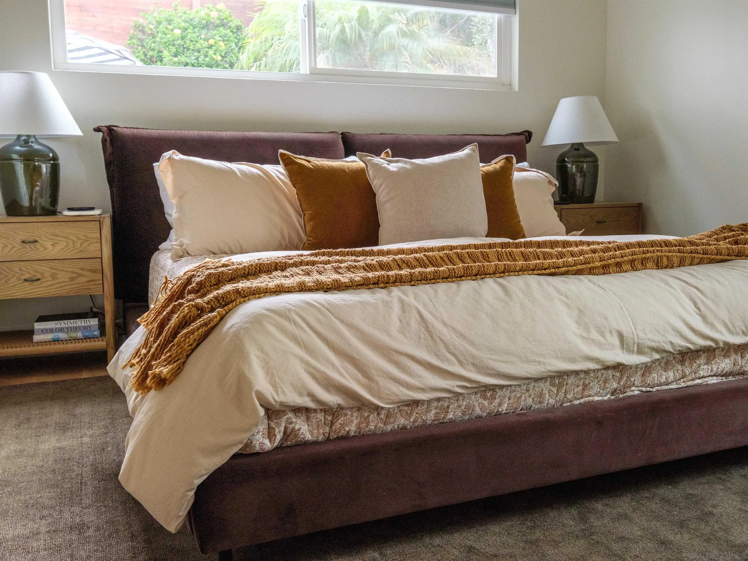 1915 Montgomery Avenue Cardiff-by-the-Sea, CA 92007 - Photo 16 of 32 a bed sitting in a bedroom next to a window