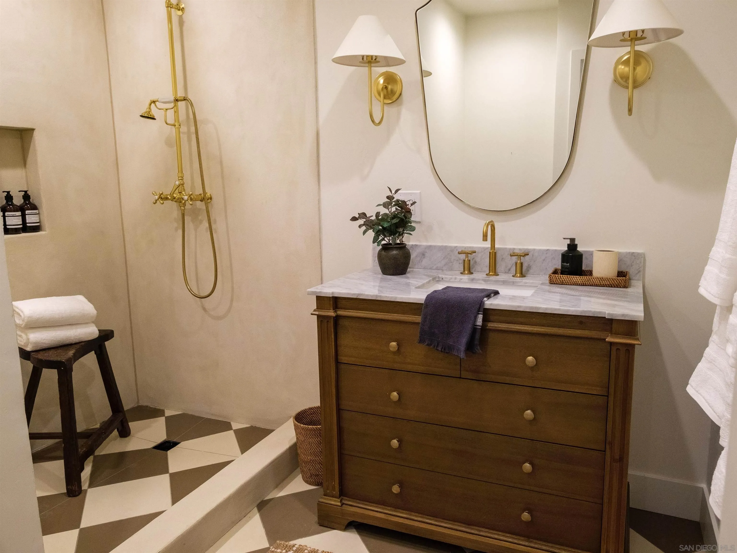 1915 Montgomery Avenue Cardiff-by-the-Sea, CA 92007 - Photo 18 of 32 a bathroom with a sink vanity and a mirror