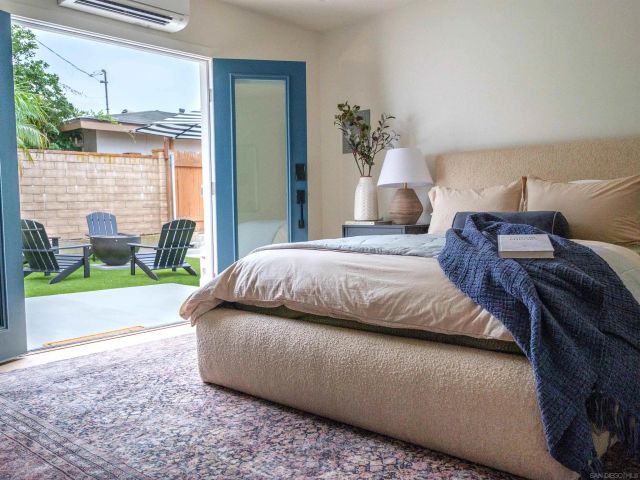 a bedroom with a bed and window