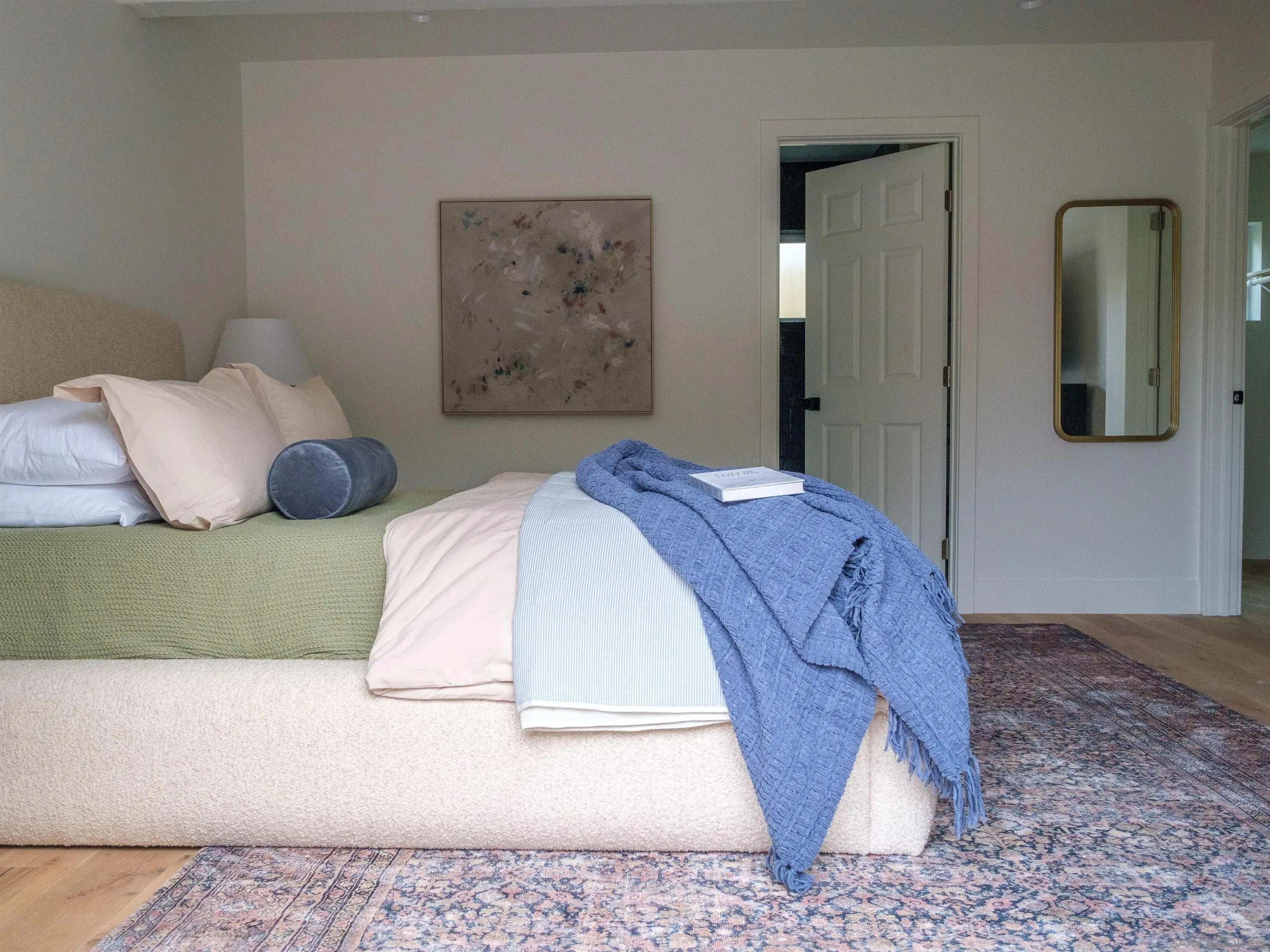 1915 Montgomery Avenue Cardiff-by-the-Sea, CA 92007 - Photo 27 of 32 a bedroom with a bed and painting on the wall