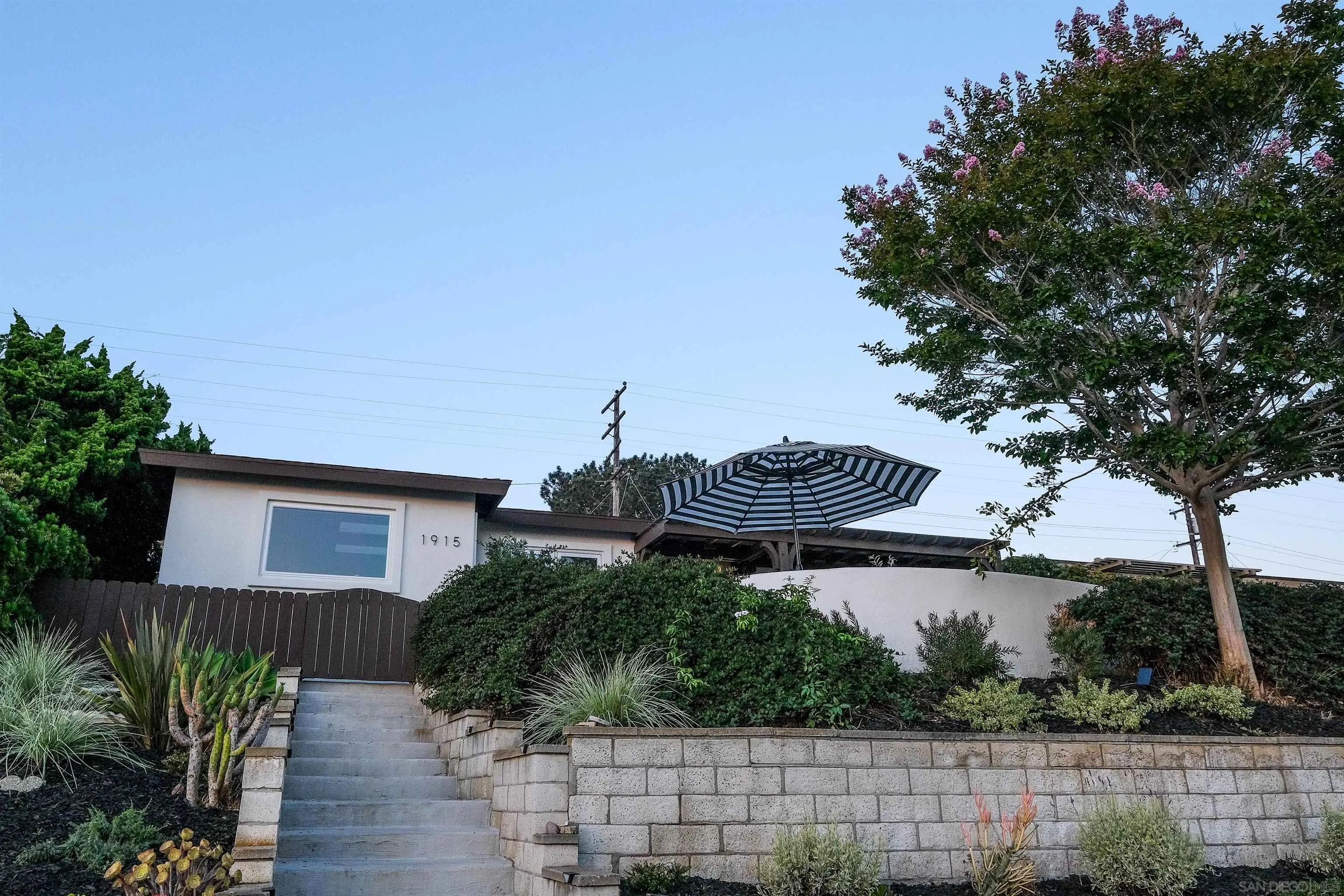 1915 Montgomery Avenue Cardiff-by-the-Sea, CA 92007 - Photo 29 of 32 a view of a house with a yard and furniture