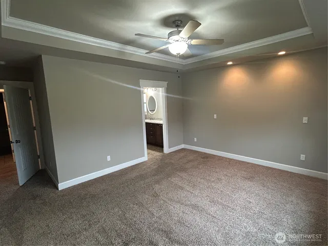 a view of a room with window and hardwood floor
