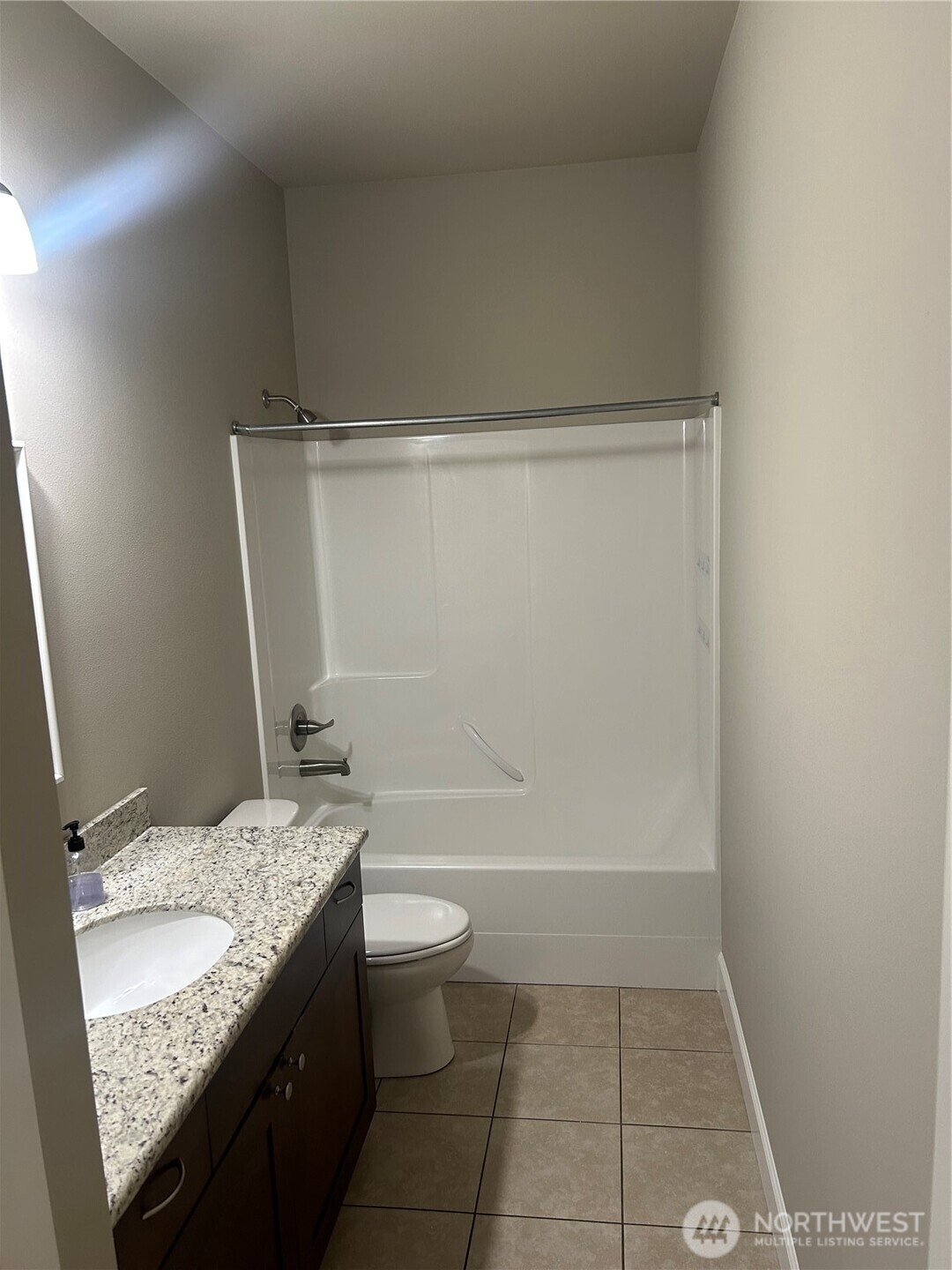 138 Summer Breeze Road Manson, WA 98831 - Photo 19 of 22 a bathroom with a granite countertop sink toilet and shower