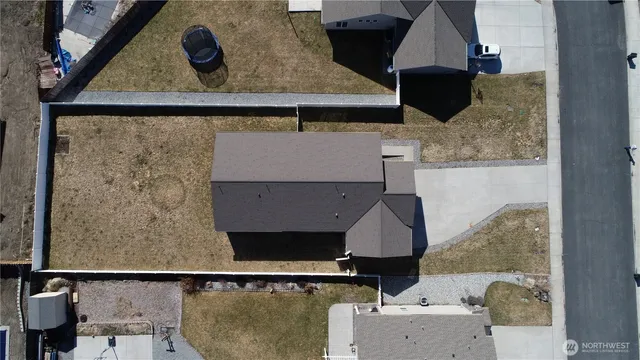 a view of a big yard with an outdoor seating