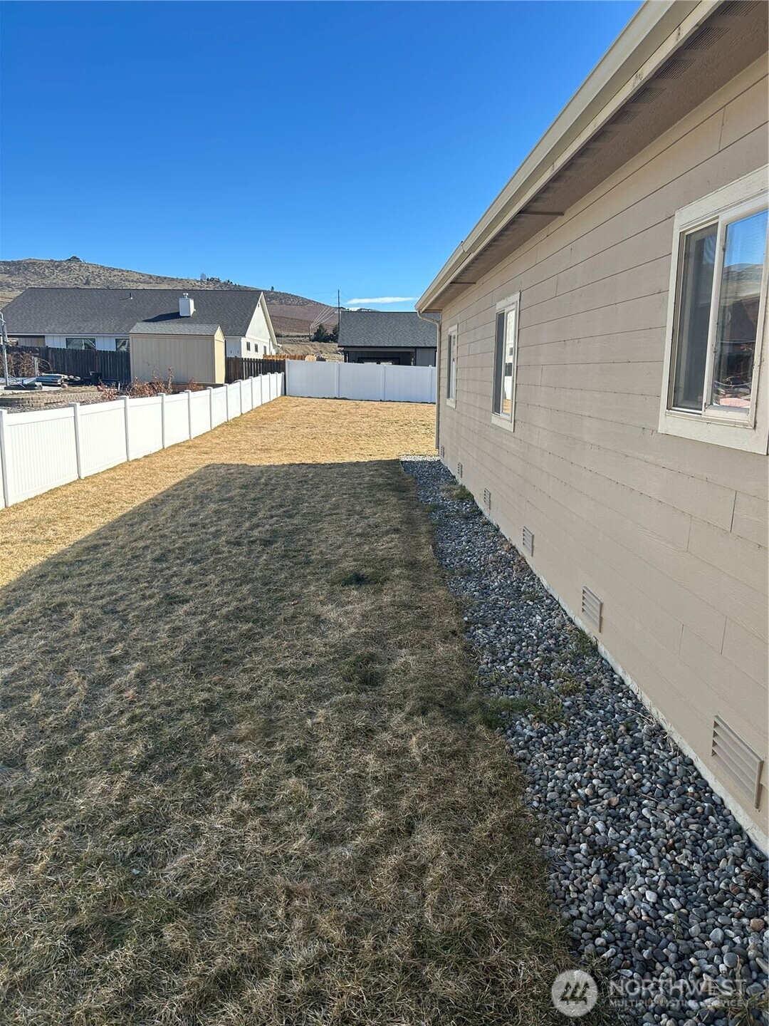 138 Summer Breeze Road Manson, WA 98831 - Photo 6 of 22 a view of a big yard with an outdoor seating