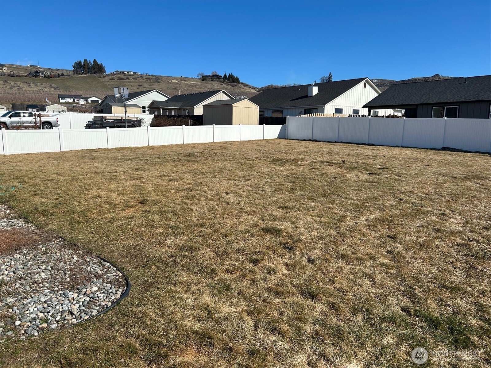 138 Summer Breeze Road Manson, WA 98831 - Photo 7 of 22 a view of a yard with an house and car parked