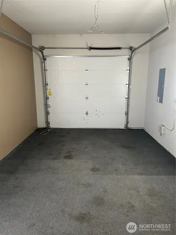 a view of a kitchen with a sink and a refrigerator