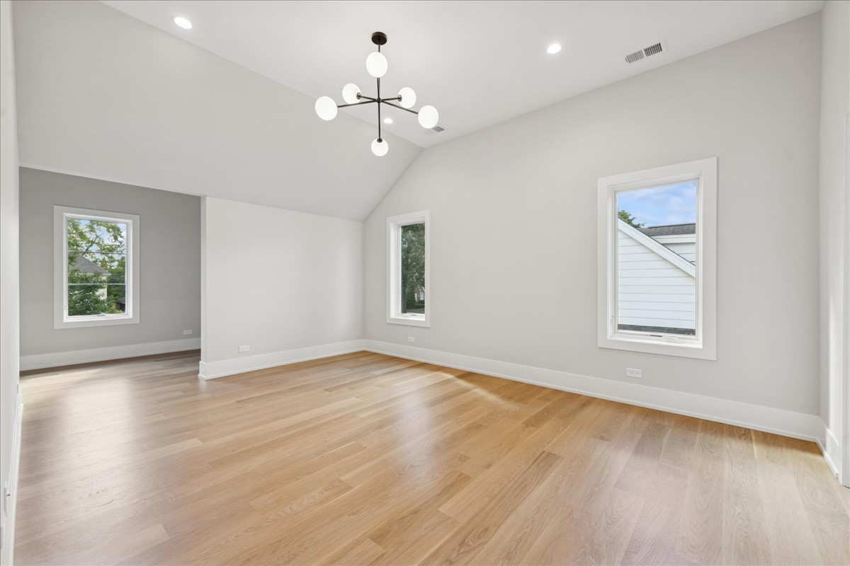 580 Kearsage Avenue Elmhurst, IL 60126 - Photo 35 of 43 a view of an empty room with wooden floor and a window