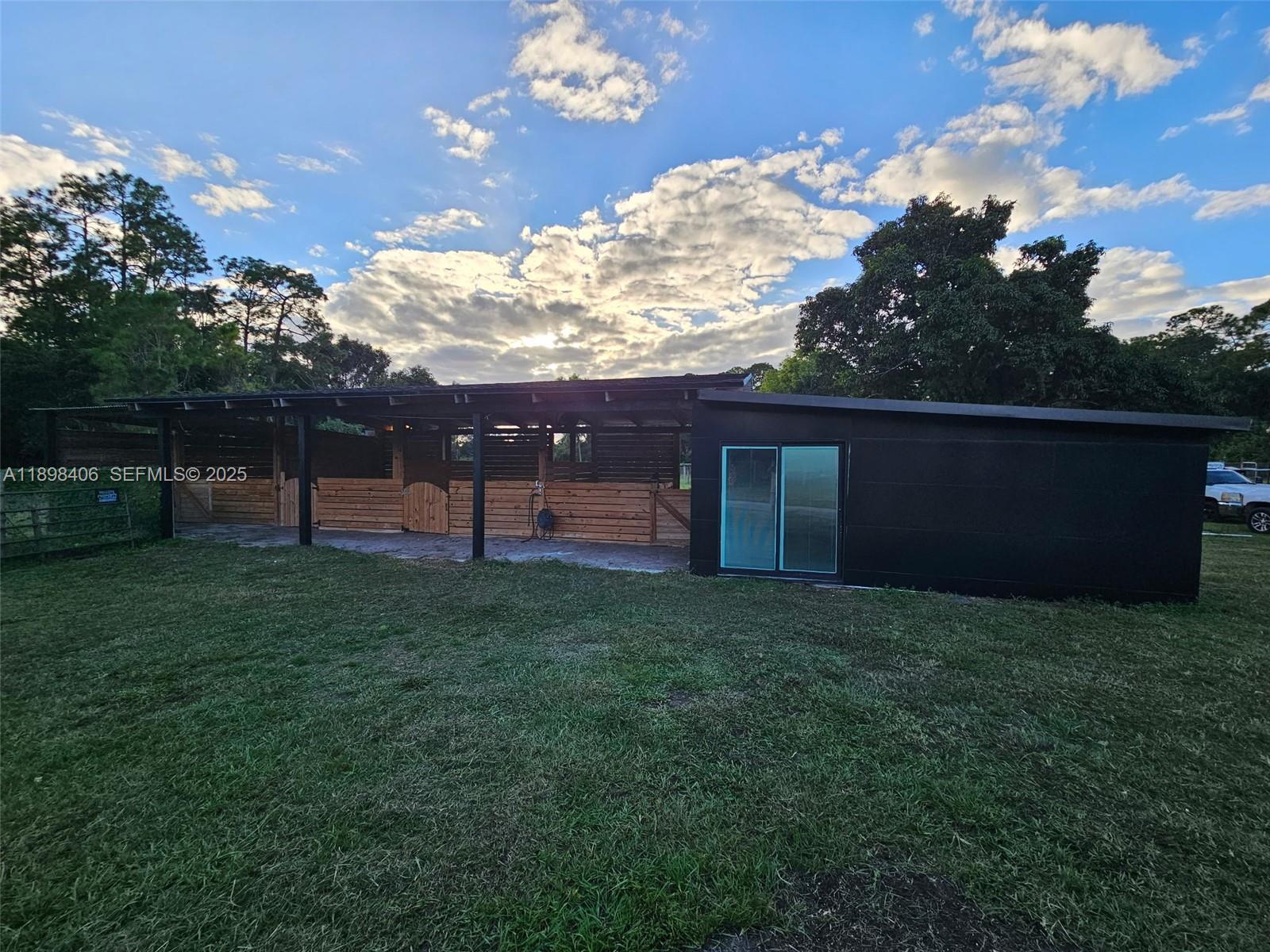 15696 Ferris Place Loxahatchee, FL 33470 - Photo 2 of 9 a view of a green field
