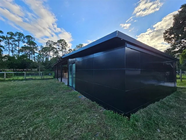 a backyard of a house with lots of green space