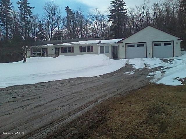 74 East Main Road Peru, MA 01235 - Photo 1 of 22 a house with trees in the background