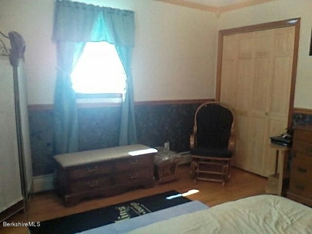 74 East Main Road Peru, MA 01235 - Photo 14 of 22 a bedroom with a bed and a chair