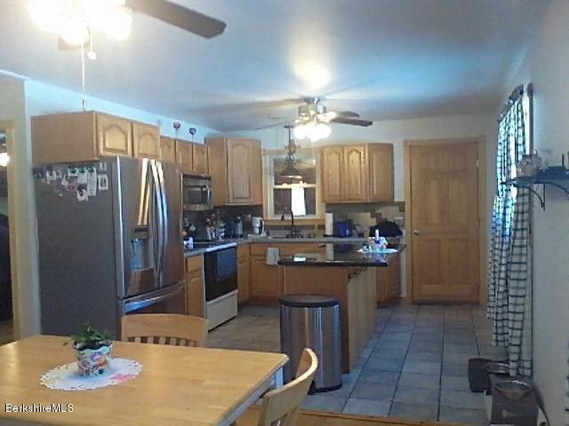 74 East Main Road Peru, MA 01235 - Photo 3 of 22 a large kitchen with cabinets