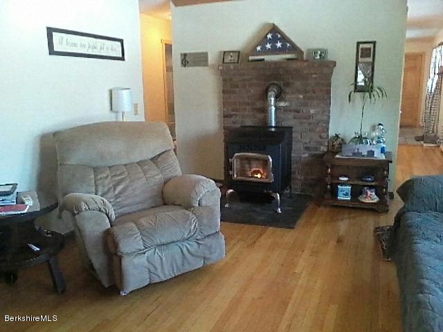 74 East Main Road Peru, MA 01235 - Photo 6 of 22 a living room with furniture and a fireplace