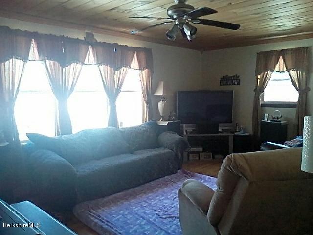 74 East Main Road Peru, MA 01235 - Photo 8 of 22 a living room with furniture and a flat screen tv