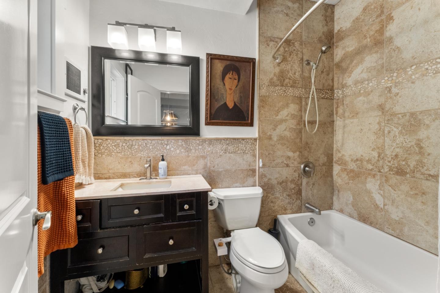 140 Baker Road Aptos, CA 95003 - Photo 27 of 62 a bathroom with a toilet a sink a bathtub and a mirror
