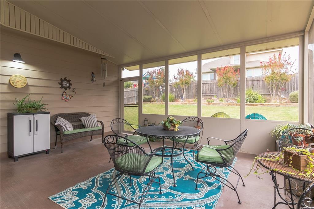 252 Pond View Pass Buda, TX 78610 - Photo 27 of 37 Sunroom / solarium with outdoor dining area and lofted ceiling