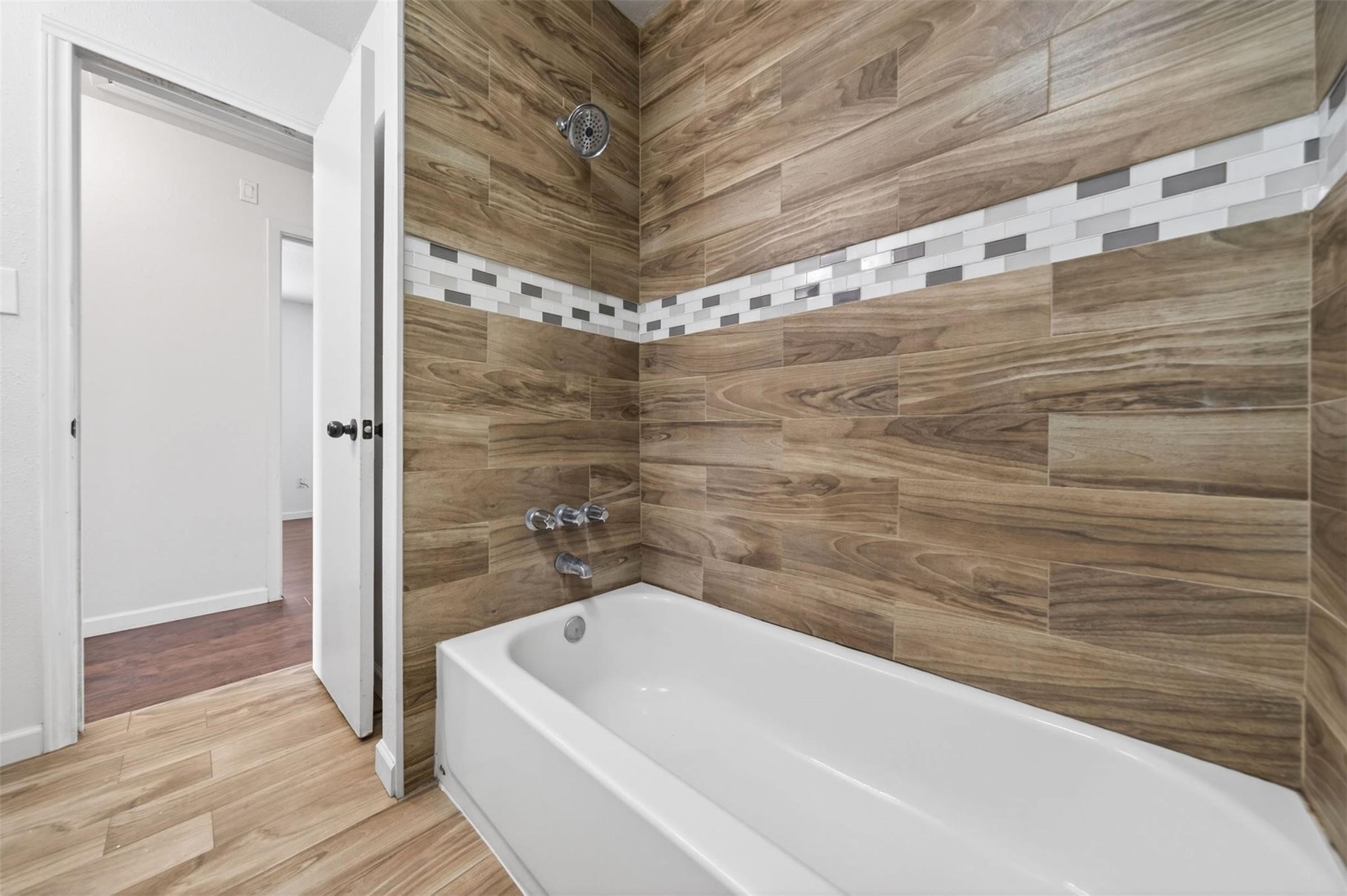 17002 Dew Drop Lane Houston, TX 77095 - Photo 20 of 24 a bathroom with a bathtub and shower
