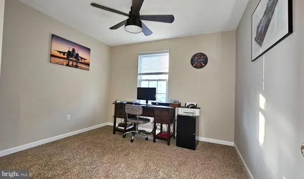 a view of a workspace with furniture