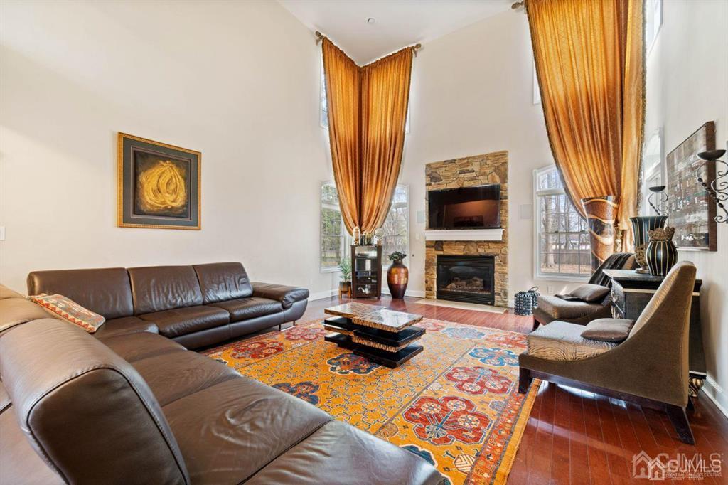 22 Utica Road Edison, NJ 08820 - Photo 12 of 28 a living room with furniture a fireplace and a large window