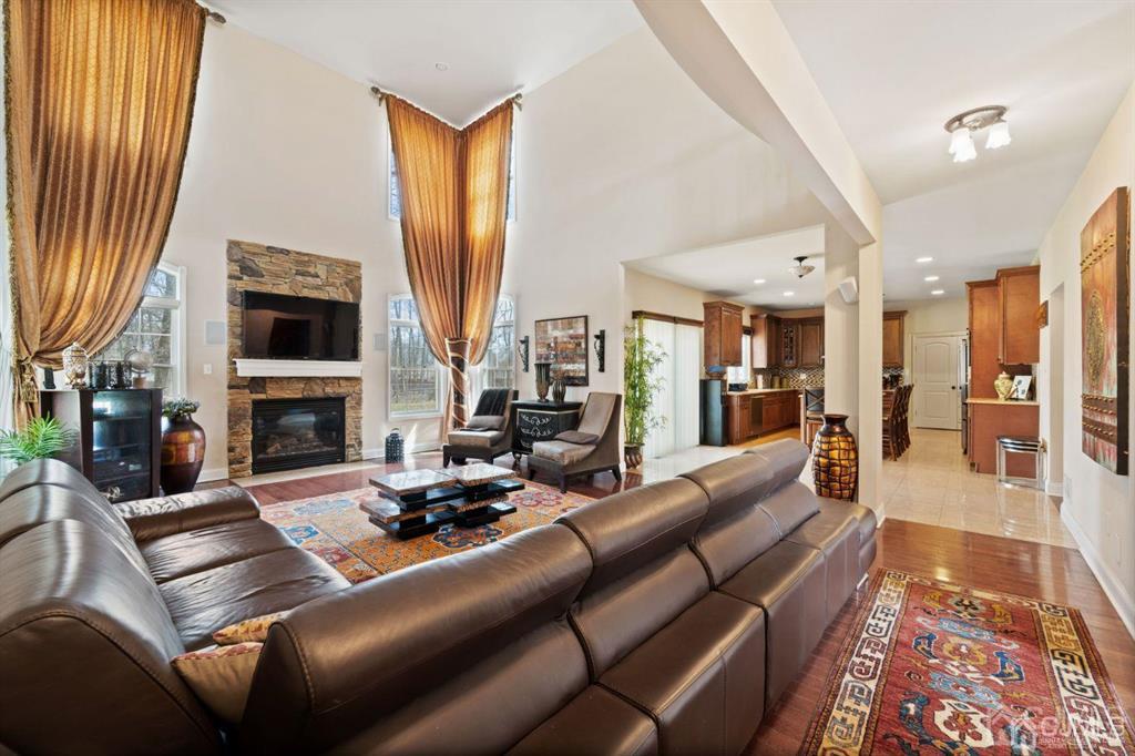 22 Utica Road Edison, NJ 08820 - Photo 13 of 28 a living room with furniture fireplace and a flat screen tv