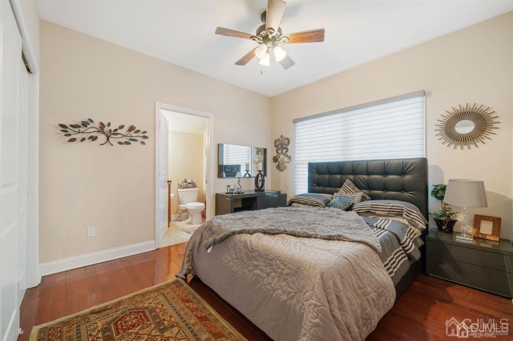 22 Utica Road Edison, NJ 08820 - Photo 15 of 28 a bed room with a bed and a chandelier