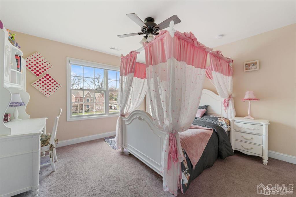22 Utica Road Edison, NJ 08820 - Photo 17 of 28 a bedroom with a bed and a window