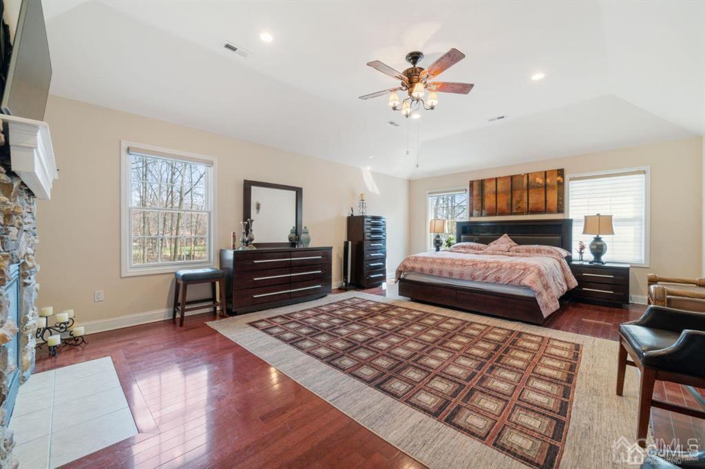 22 Utica Road Edison, NJ 08820 - Photo 19 of 28 a bedroom with a large bed and a chandelier
